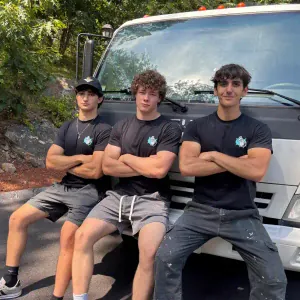 The Junk Heroes crew in front of their truck