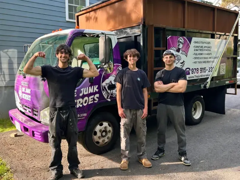 The Junk Heroes crew with their junk removal truck in Swampscott, MA