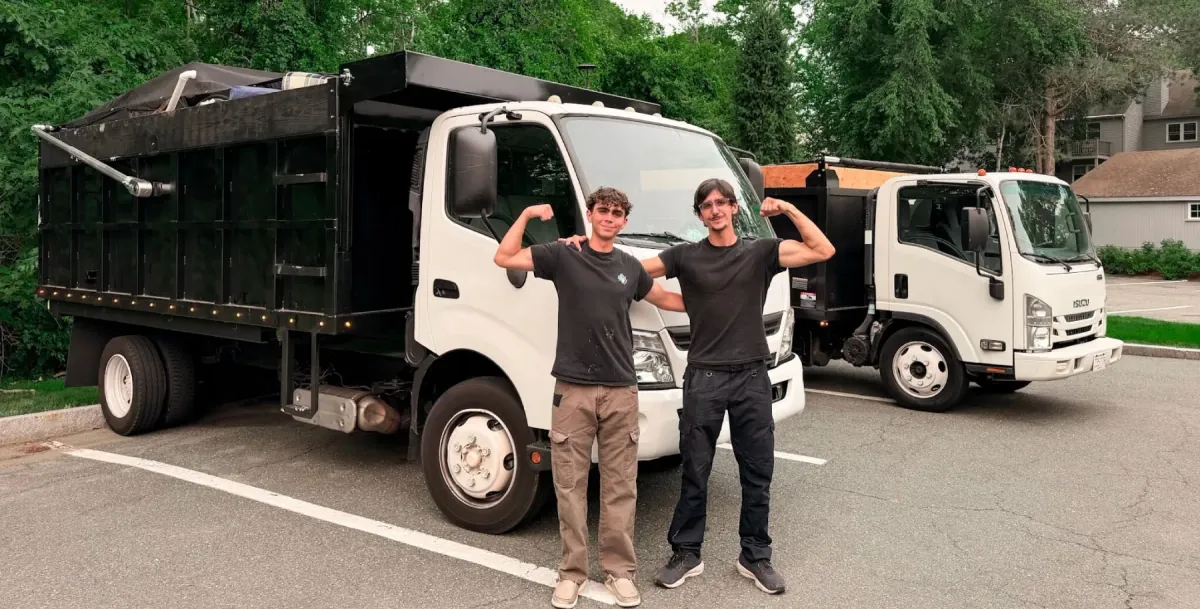 Henrique and Filipe with both Junk Heroes dump trucks, ready for a commercial job in Salem, MA