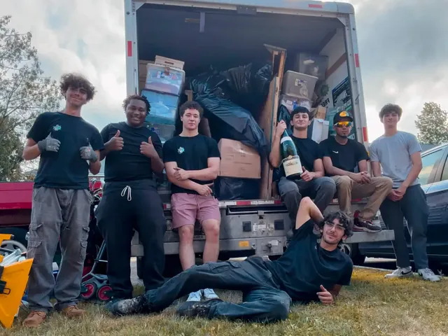 The Junk Heroes crew with a box truck loaded to the roof after a full property cleanout on the North Shore