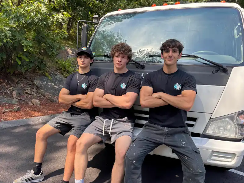 The Junk Heroes crew in front of their truck